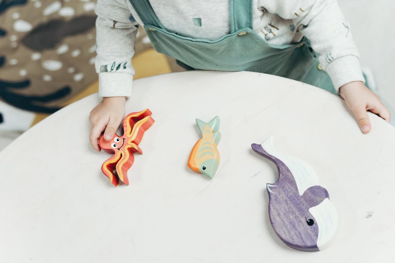 child playing with toys at occupational therapy session